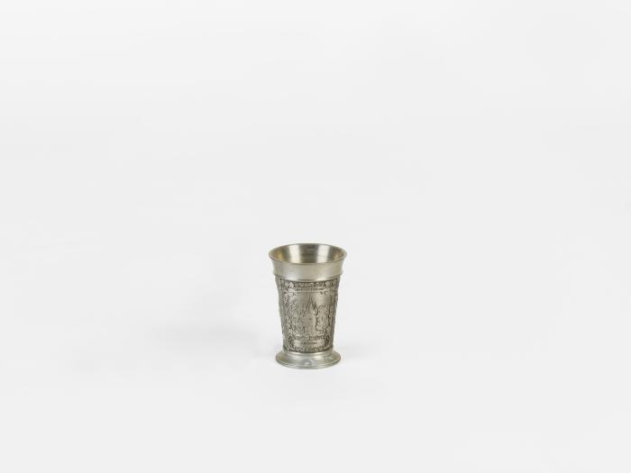 KEEPSAKE METAL SHOT GLASS WITH EMBOSSED DECORATION